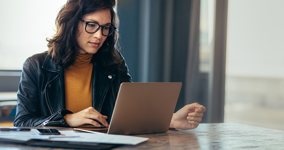 Asian woman working laptop. Business woman busy working on laptop computer at office.